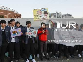 Nov 14, 2019 - Sangju, South Korea-A Group of High Schoolers cheer up for their senior group at entrance gate of Sangju high school in Sangj...