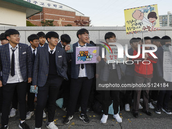 Nov 14, 2019 - Sangju, South Korea-A Group of High Schoolers cheer up for their senior group at entrance gate of Sangju high school in Sangj...