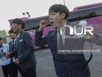 Nov 14, 2019 - Sangju, South Korea-A Group of High Schoolers cheer up for their senior group at entrance gate of Sangju high school in Sangj...