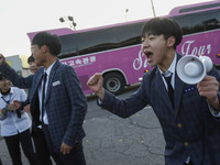 Nov 14, 2019 - Sangju, South Korea-A Group of High Schoolers cheer up for their senior group at entrance gate of Sangju high school in Sangj...