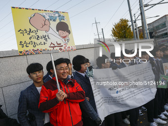 Nov 14, 2019 - Sangju, South Korea-A Group of High Schoolers cheer up for their senior group at entrance gate of Sangju high school in Sangj...