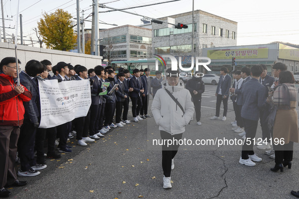 Nov 14, 2019 - Sangju, South Korea-A Group of High Schoolers cheer up for their senior group at entrance gate of Sangju high school in Sangj...