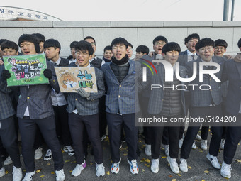 Nov 14, 2019 - Sangju, South Korea-A Group of High Schoolers cheer up for their senior group at entrance gate of Sangju high school in Sangj...