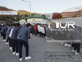 Nov 14, 2019 - Sangju, South Korea-A Group of High Schoolers cheer up for their senior group at entrance gate of Sangju high school in Sangj...