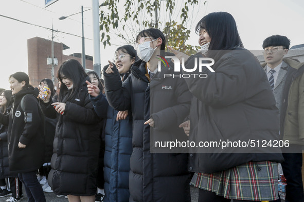 Nov 14, 2019 - Sangju, South Korea-A Group of High Schoolers cheer up for their senior group at entrance gate of Sangju high school in Sangj...