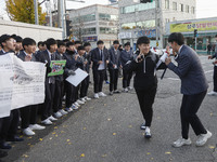 Nov 14, 2019 - Sangju, South Korea-A Group of High Schoolers cheer up for their senior group at entrance gate of Sangju high school in Sangj...