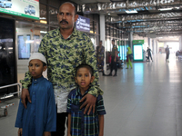 Nurul  Islam along with his two kids seen waiting to receive his wife Sumi Akter at Hazrat Shahjalal International Airport in Dhaka, Banglad...