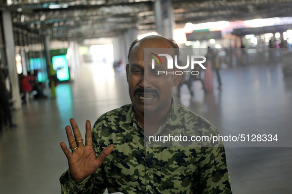 Nurul Islam seen reacting while talking with journalists as he waits to receive his wife Sumi Akter at Hazrat Shahjalal International Airpor...