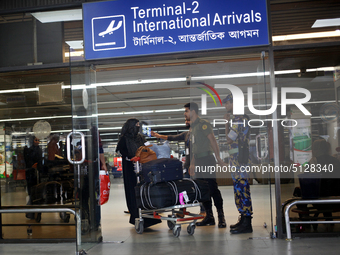 Women Migrant workers seen returning from Saudi Arabia at Hazrat Shahjalal International Airport in Dhaka, Bangladesh on 15 November  2019....