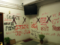 A view of an anti-administration slogan painted by the protesting students who are demanding the roll back of the hostel fee hike, at Jawaha...