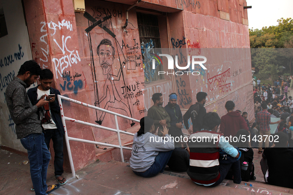 A view of an anti-administration slogan painted by the protesting students who are demanding the roll back of the hostel fee hike, at Jawaha...