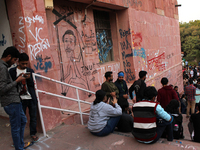 A view of an anti-administration slogan painted by the protesting students who are demanding the roll back of the hostel fee hike, at Jawaha...