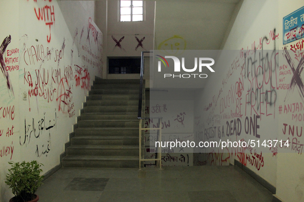 A view of an anti-administration slogan painted by the protesting students who are demanding the roll back of the hostel fee hike, at Jawaha...