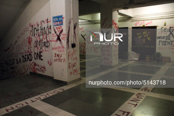 A view of an anti-administration slogan painted by the protesting students who are demanding the roll back of the hostel fee hike, at Jawaha...