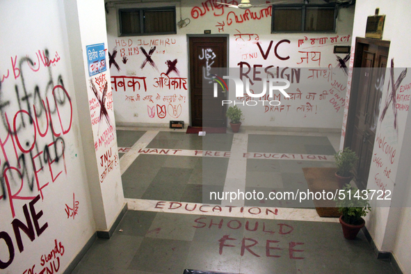 A view of an anti-administration slogan painted by the protesting students who are demanding the roll back of the hostel fee hike, at Jawaha...