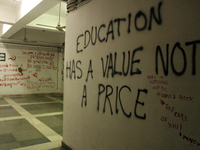 A view of an anti-administration slogan painted by the protesting students who are demanding the roll back of the hostel fee hike, at Jawaha...