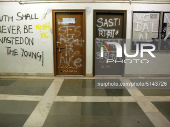 A view of an anti-administration slogan painted by the protesting students who are demanding the roll back of the hostel fee hike, at Jawaha...