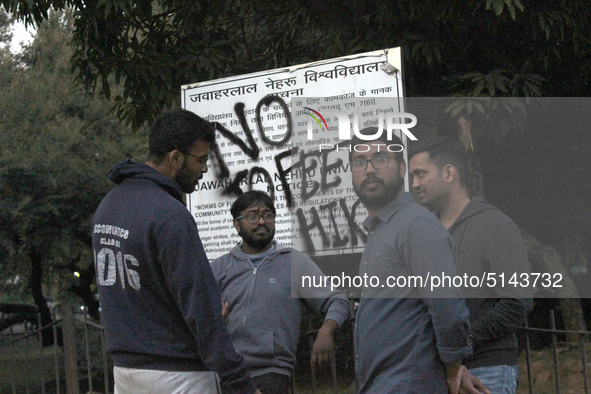 A view of an anti-administration slogan painted by the protesting students who are demanding the roll back of the hostel fee hike, at Jawaha...