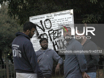 A view of an anti-administration slogan painted by the protesting students who are demanding the roll back of the hostel fee hike, at Jawaha...