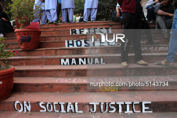 A view of an anti-administration slogan painted by the protesting students who are demanding the roll back of the hostel fee hike, at Jawaha...