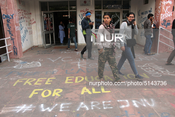 A view of an anti-administration slogan painted by the protesting students who are demanding the roll back of the hostel fee hike, at Jawaha...