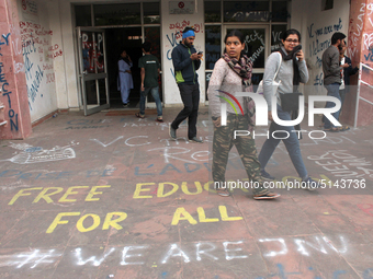 A view of an anti-administration slogan painted by the protesting students who are demanding the roll back of the hostel fee hike, at Jawaha...