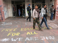 A view of an anti-administration slogan painted by the protesting students who are demanding the roll back of the hostel fee hike, at Jawaha...