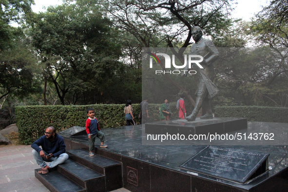 Students are seen sitting around the statue of Jawahar Lal Nehru after the press conference against the usage of Police force on protesting...