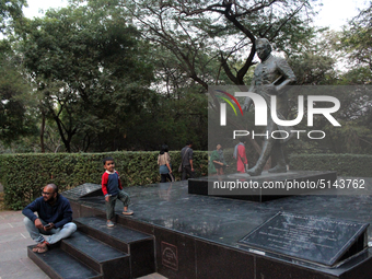 Students are seen sitting around the statue of Jawahar Lal Nehru after the press conference against the usage of Police force on protesting...