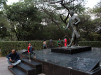 Students are seen sitting around the statue of Jawahar Lal Nehru after the press conference against the usage of Police force on protesting...