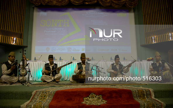 SRINAGAR, INDIAN ADMINISTERED KASHMIR, INDIA -APRIL 07: Kashmiri singers perform with the traditional musical instruments during a function...