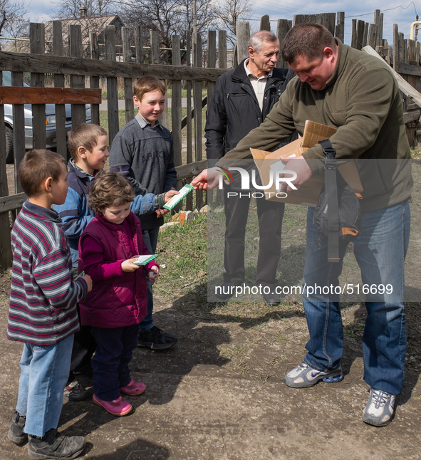 Pastor Ivanov distributing cookies and chocolate to the kids coming for his visit. On April 6 2015, we visit Krasnogorovka. What we saw is t...