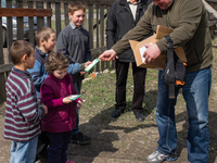 Pastor Ivanov distributing cookies and chocolate to the kids coming for his visit. On April 6 2015, we visit Krasnogorovka. What we saw is t...