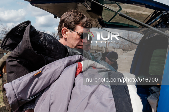 Volunteer helping taking out the clothes from the pastor's car. On April 6 2015, we visit Krasnogorovka. What we saw is the evident beginnin...