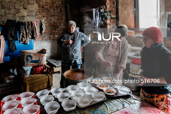 Volunteers helping at the preparation of hundred of meals that they are going to serve that day. On April 6 2015, we visit Krasnogorovka. Wh...