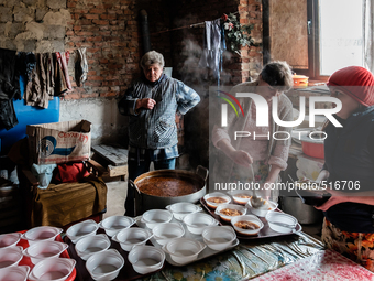 Volunteers helping at the preparation of hundred of meals that they are going to serve that day. On April 6 2015, we visit Krasnogorovka. Wh...