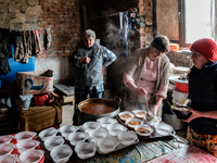 Volunteers helping at the preparation of hundred of meals that they are going to serve that day. On April 6 2015, we visit Krasnogorovka. Wh...