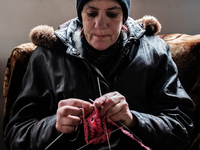 Lira, 47 years old while waiting for the communial meal. She leave alone and like so many others, rely only on humanitarian aid to be able t...