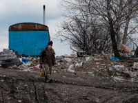 Man walking out of the city dump. On April 6 2015, we visit Krasnogorovka. What we saw is the evident beginning of a serious humanitarian cr...