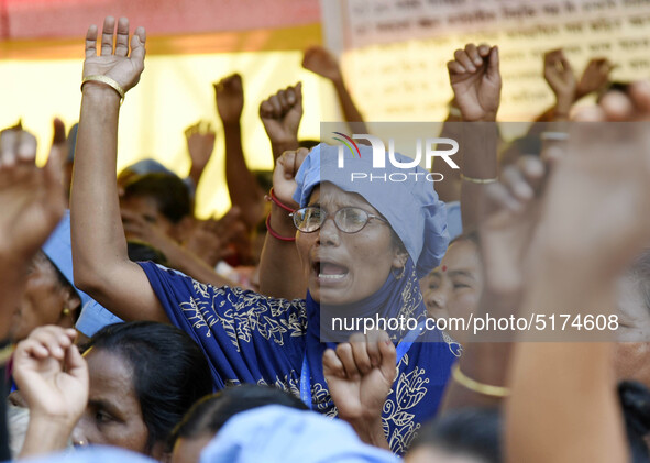 All-Assam Mid-Day Meal Workers Union activists stage a protest against government's move to hand over the Mid-Day Meal Scheme to NGO, during...