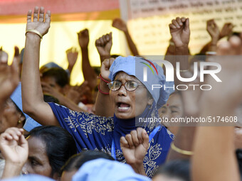 All-Assam Mid-Day Meal Workers Union activists stage a protest against government's move to hand over the Mid-Day Meal Scheme to NGO, during...