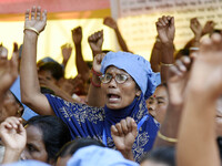 All-Assam Mid-Day Meal Workers Union activists stage a protest against government's move to hand over the Mid-Day Meal Scheme to NGO, during...