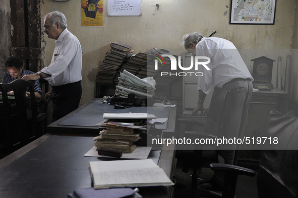 Arshad  Saleem (Left) and Anwar Saleem (Right) - two brothers who runs The Russell Exchange during the old clothes auction at The Russell Ex...