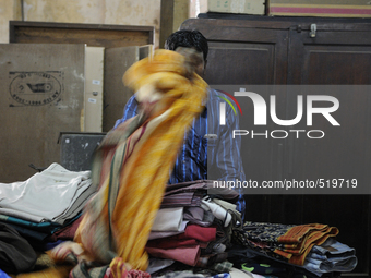 Vikram- A buyer of old clothes who buys stuff in auction and sells it on the streets during the old clothes auction at The Russell Exchange...