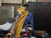 Vikram- A buyer of old clothes who buys stuff in auction and sells it on the streets during the old clothes auction at The Russell Exchange...