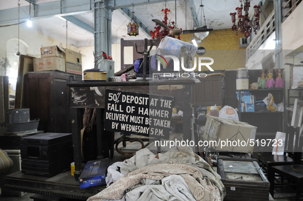 The high chair and table where the auctioneer sits during the sunday auctions during the old clothes auction at The Russell Exchange on thur...