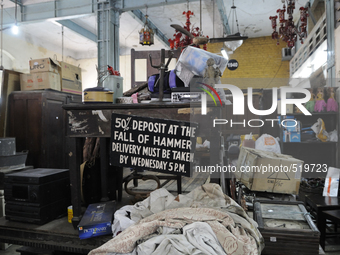 The high chair and table where the auctioneer sits during the sunday auctions during the old clothes auction at The Russell Exchange on thur...