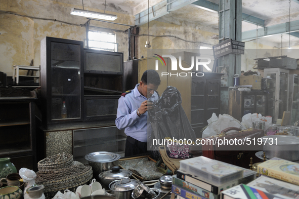 Tarun chatterjee who works as a security guard nearby checking stuff to be auctioned tomorrow at The Russell Exchange on Saturday a day prio...