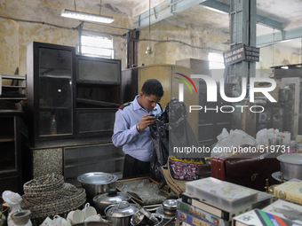 Tarun chatterjee who works as a security guard nearby checking stuff to be auctioned tomorrow at The Russell Exchange on Saturday a day prio...