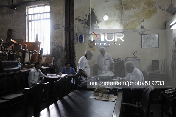 Arshad  Saleem ( R ) addressing a customer issue at The Russell Exchange on Saturday a day prior to the sunday auction on 4th April , 2015 i...